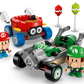 The LEGO® Super Mario™ Mario Kart™ – Baby Mario vs. Baby Luigi set by Legos - Toyhouse includes Baby Mario and Baby Luigi figures, a red car, a green go-kart, plus two background items on stands for exciting race play.