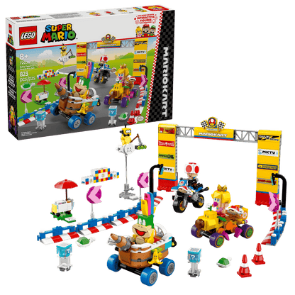 Kickstart the excitement with the LEGO® Super Mario™ Mario Kart™ – Baby Peach & Grand Prix Set by Legos - Toyhouse, featuring vehicles, characters, a finish line arch, and accessories—all displayed with the product box in the background.