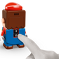 A hand presses the power button on the LEGO® Super Mario™ Mario Kart™ – Interactive LEGO® Mario™ & Standard Kart from Legos - Toyhouse, which also has a Bluetooth button for connecting to your LEGO Mario Kart racetrack playset.