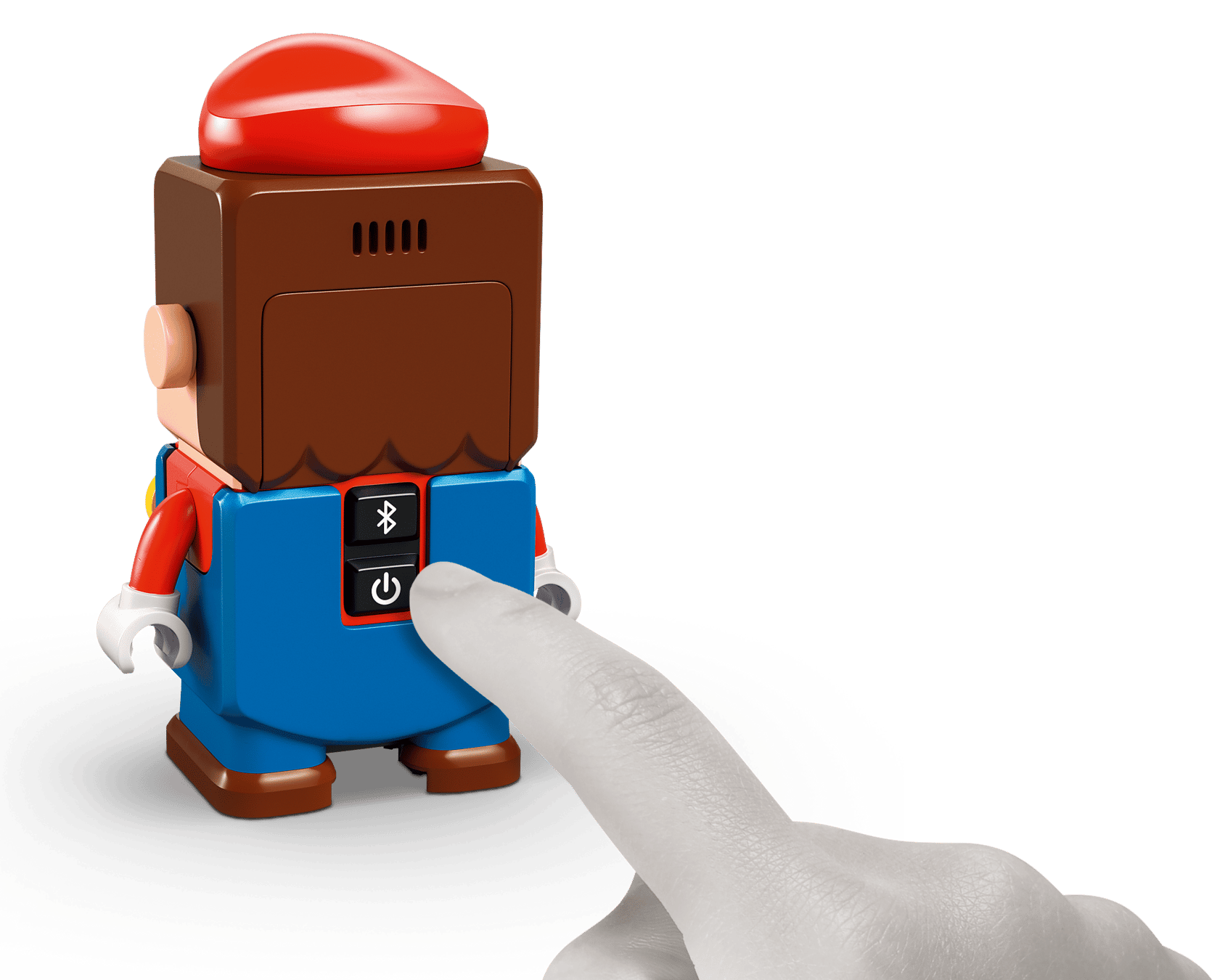 A hand presses the power button on the LEGO® Super Mario™ Mario Kart™ – Interactive LEGO® Mario™ & Standard Kart from Legos - Toyhouse, which also has a Bluetooth button for connecting to your LEGO Mario Kart racetrack playset.