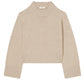 CO's Cropped Oversized Cashmere Sweater in beige features long sleeves, ribbed hem, cuffs, and collar, with an oversized silhouette shown on a white background.