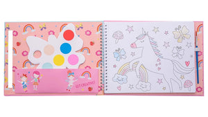 The Rainbow Fairy My Painting Pad by Floss and Rock is an open spiral-bound paint pad decorated with unicorns, rainbows, and butterflies, featuring a butterfly-shaped watercolor palette and a paintbrush on the left side.