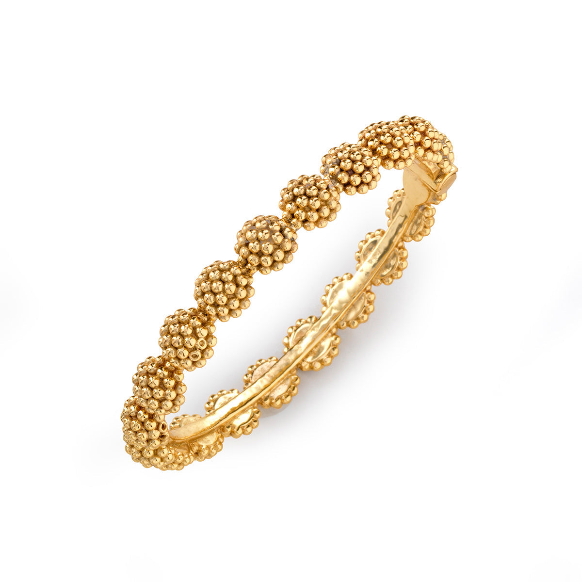 The Berry Eternity Hinged Bangle in gold by Juliska Capucine De Wulf features a textured, clustered bead design—an elegant, feminine accessory that elevates any bracelet stack when worn against a clean white backdrop.