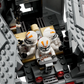 Three LEGO® Star Wars clone trooper minifigures sit inside the LEGO® Star Wars AT-TE Walker, a gray vehicle with open hinged panels that reveal its detailed interior.
