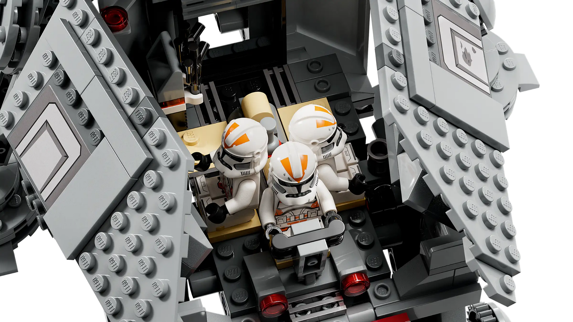 Three LEGO® Star Wars clone trooper minifigures sit inside the LEGO® Star Wars AT-TE Walker, a gray vehicle with open hinged panels that reveal its detailed interior.