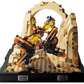 Celebrate LEGO Star Wars™ 25th anniversary with the LEGO® Star Wars™ Mos Espa Podrace™ Diorama by Legos - Toyhouse, featuring two podracers racing through a sandy, rock-arched scene.