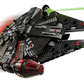 The LEGO® Star Wars™ The Dark Falcon by Legos - Toyhouse is depicted soaring through space, firing green lasers, with motion blur emphasizing the speed of this buildable toy vehicle set.