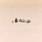 The LEGO® Star Wars™ The Mandalorian & Grogu's Speeder Bike™ by Legos - Toyhouse features Mandalorian and Grogu minifigures beside a small speeder bike building toy for kids on a plain beige background.