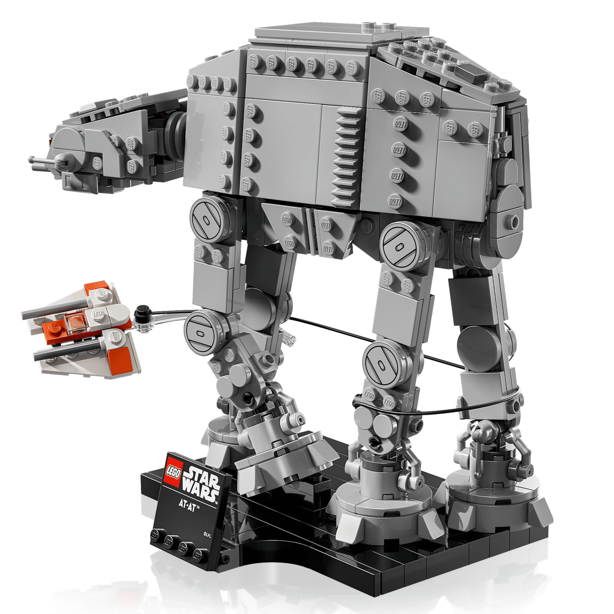 The LEGO® Star Wars™ AT-AT™ set by Legos - Toyhouse features a detailed AT-AT, small snowspeeder, and name plaque, recreating the iconic Battle of Hoth against a white backdrop.