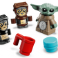 Three minifigures from the LEGO® Star Wars™ Anzellan Starship by Legos - Toyhouse are posed with a red mug and blue piece on a white background—an ideal display for Mandalorian toy fans and collectors.
