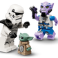 Three minifigures—a stormtrooper, a green alien, and a purple character with a blaster—face off in this detailed Legos - Toyhouse LEGO® Star Wars™ The Razor Crest™ building set, inspired by The Mandalorian.