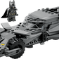 The LEGO® Batman™ v Superman™ Batmobile™ by Legos - Toyhouse features a heroic Batman minifigure beside the detailed gray Batmobile, making it an ideal display piece for fans.