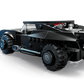 A LEGO® Batman™ minifigure stands by the LEGO® Batman™ The Batman™ Batmobile™, a Legos - Toyhouse model featuring large wheels and a detailed rear jet exhaust.