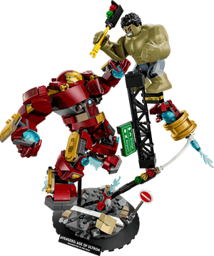 LEGO® Marvel Epic Battle: Hulkbuster vs. The Hulk by Legos - Toyhouse features Iron Man in the Hulkbuster armor and Hulk in a dynamic Age of Ultron scene, complete with debris and street signs for a detailed Marvel display.