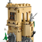 Build magical scenes with the LEGO® Harry Potter™ Hogwarts™ Castle: Flying Lessons by Legos - Toyhouse, featuring a tan castle tower with windows, rocky base, greenery, and medieval weapons—ideal for expanding your Harry Potter playset collection!.