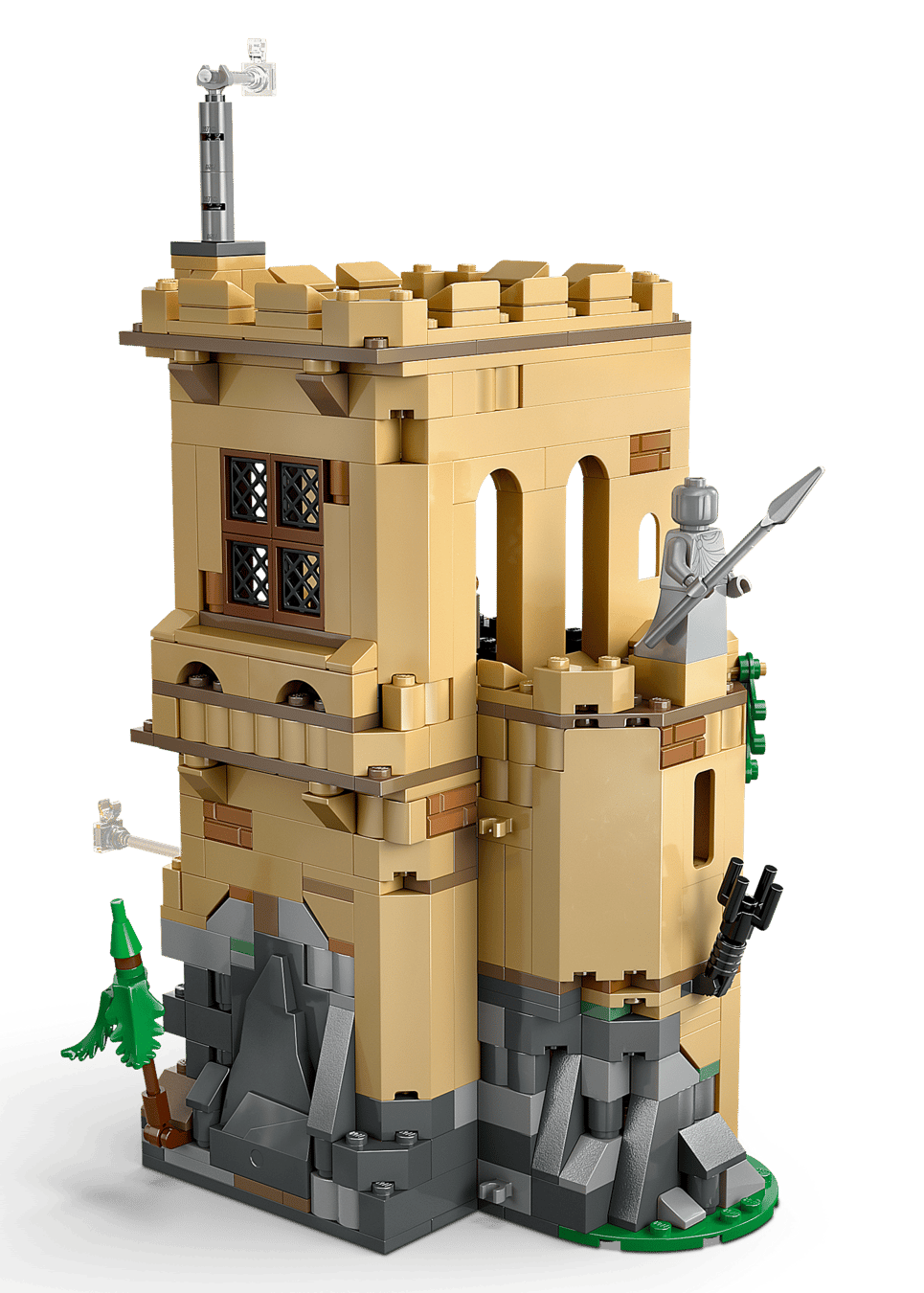 Build magical scenes with the LEGO® Harry Potter™ Hogwarts™ Castle: Flying Lessons by Legos - Toyhouse, featuring a tan castle tower with windows, rocky base, greenery, and medieval weapons—ideal for expanding your Harry Potter playset collection!.