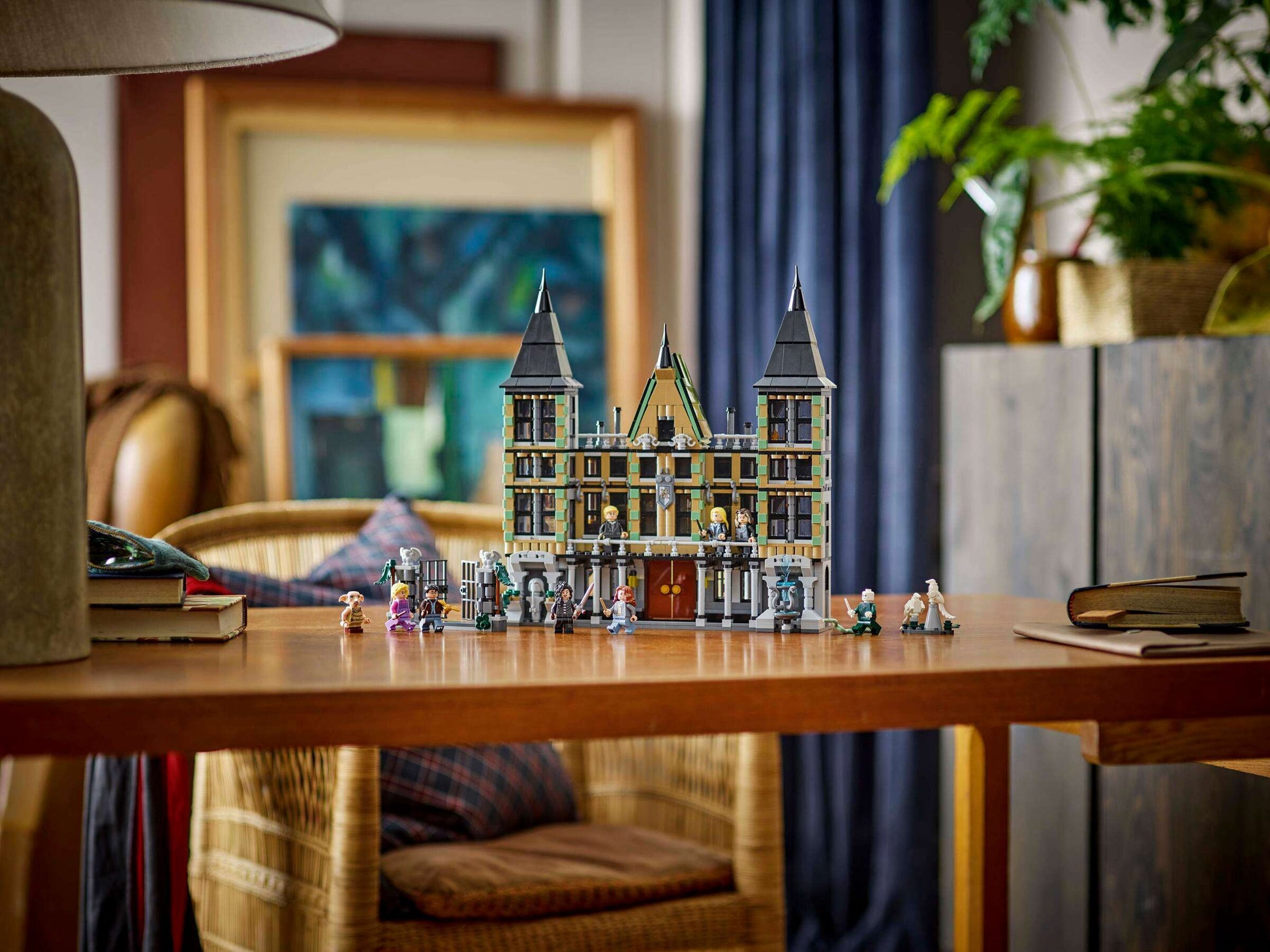 The LEGO® Harry Potter™ Malfoy Manor by Legos - Toyhouse features mini-figures and makes a magical gift or striking centerpiece for any wizarding toy collection.