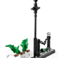 Recreate the Privet Drive escape with LEGO® Harry Potter™ Hagrid™ & Harry's Privet Drive Escape by Legos - Toyhouse, featuring a lamppost, white bench, green plants, chain, and curved sidewalk—ideal for flying motorcycle adventures.