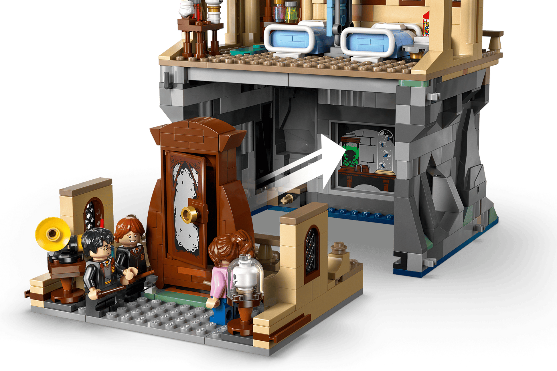 The LEGO® Harry Potter™ Hogwarts™ Castle: Hospital Wing by Legos - Toyhouse includes four minifigures at the detailed entrance, plus a secret room with a green creature behind a window in this magical playset.