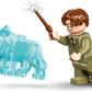 A LEGO® Harry Potter™ minifigure from the Hogwarts™ Castle: Hospital Wing set by Legos - Toyhouse wields a wand, casting a spell with a translucent blue wolf—an enchanting gift for any Harry Potter fan’s collection.