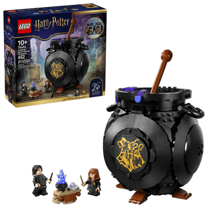 The Legos - Toyhouse Harry Potter™ Cauldron: Secret Potions Classroom set includes a round black cauldron, two minifigures, and a potion table—perfect for Harry Potter decor. The box highlights the assembled pieces and potions classroom features.