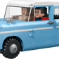 The Legos - Toyhouse LEGO® Harry Potter™ Enchanted Flying Ford Anglia™ set features a blue and white car with two minifigures inside, both surprised—one driving and one riding as a passenger.