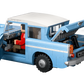 The LEGO® Harry Potter™ Enchanted Flying Ford Anglia™ by Legos - Toyhouse features an iconic blue car with an open left door and trunk, showing red seats inside and a brown suitcase partially out of the trunk.