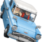 Two LEGO minifigures with surprised faces sit in the blue and white LEGO® Harry Potter™ Enchanted Flying Ford Anglia™ by Legos - Toyhouse, as the car appears airborne or tilted.