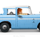 Side view of Legos - Toyhouse's LEGO® Harry Potter™ Enchanted Flying Ford Anglia™ with a blue body, white roof, orange interior, and a scale indicator showing the car is 25 cm (9.5 in) long.