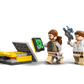 Three minifigures with tools and blasters surround a yellow container, tablet, and control panel with satellite dish—ideal for fans of dinosaur toys and the LEGO® Jurassic World™ Raptor & Titanosaurus Tracking Mission from Legos - Toyhouse.