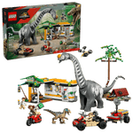 The Legos - Toyhouse LEGO® Jurassic World™ Raptor & Titanosaurus Tracking Mission playset features dinosaur figures, vehicles, minifigures, and building pieces; the kit box is shown in the background.