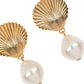 Jennifer Behr Alana Earrings showcase golden scallop shell designs with dangling baroque pearls, set against a white background.