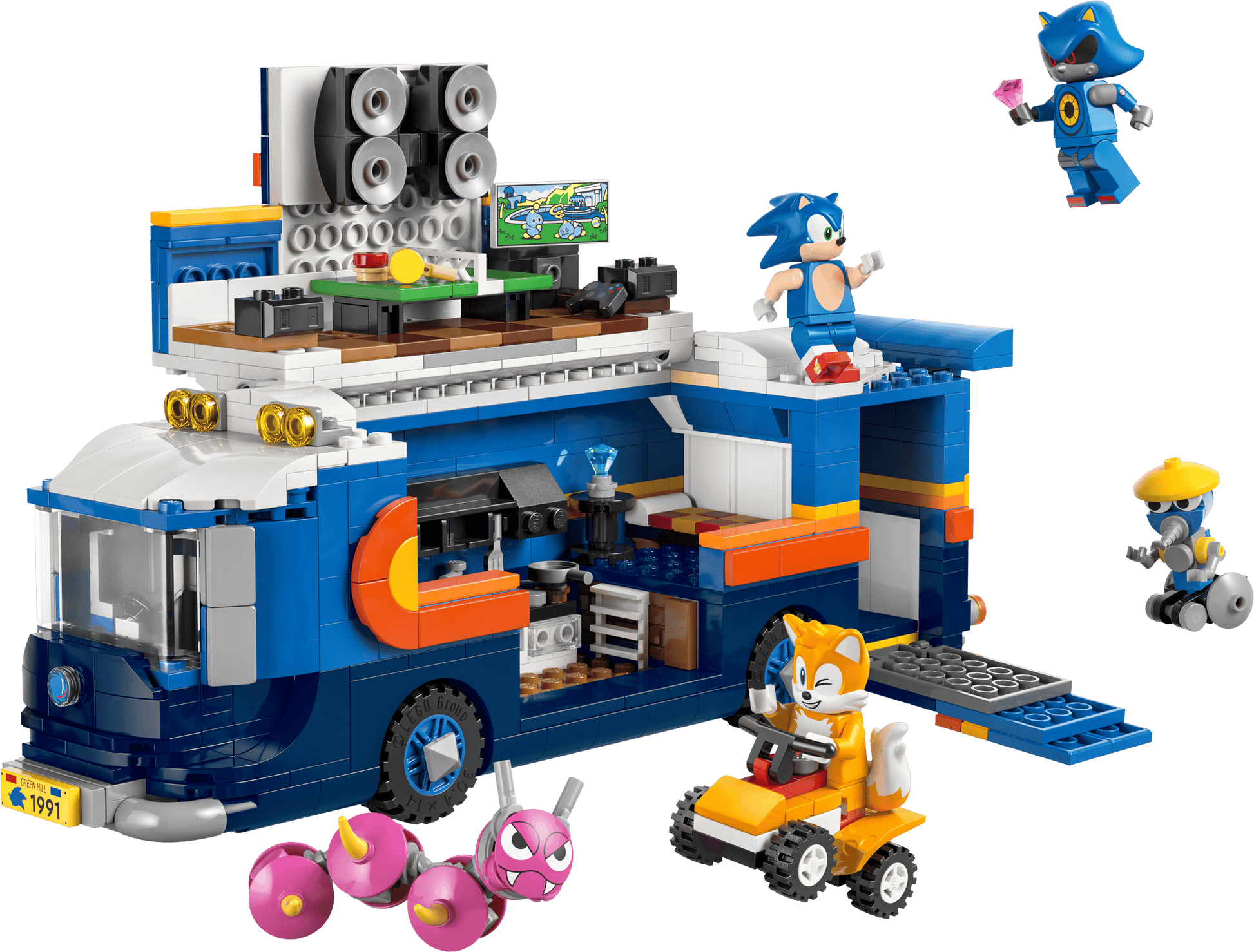 The LEGO® Sonic the Hedgehog™ Team Sonic Command Truck by Legos - Toyhouse includes a blue truck with speakers, gaming area, Sonic and Tails minifigures, enemies, cool accessories, and Tails’ own small orange vehicle.