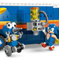 LEGO® Sonic the Hedgehog™ and a blue robot stand by the colorful Legos - Toyhouse Team Sonic Command Truck, with yellow and orange features, as they explore its mechanical arm attachment.