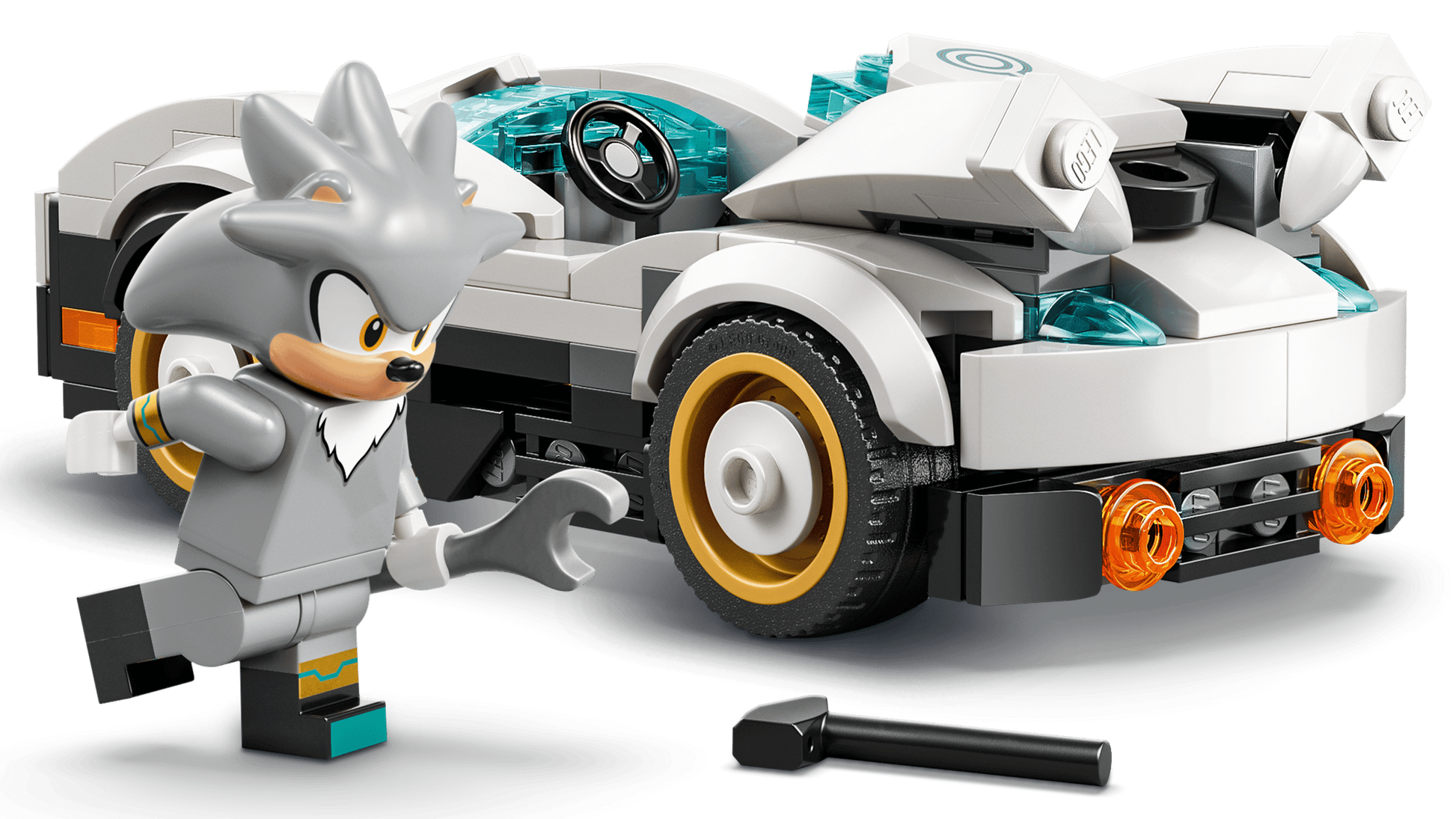 A gray LEGO minifigure with spiky hair holds a wrench beside the white Legos - Toyhouse LEGO® Sonic the Hedgehog™ Silver's Car, featuring gold and black wheels and orange headlights; a black tool is on the ground.