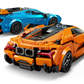 Two LEGO® Speed Champions Lamborghini Revuelto & Huracán STO model cars by Legos - Toyhouse, in orange and blue, feature sporty details and decals—ideal for car building kit fans.
