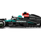 A LEGO® Speed Champions Mercedes-AMG F1® W15 Race Car by Legos - Toyhouse, shown in black with teal accents and sponsor logos, is displayed in a side view on a white background.