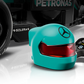 Close-up of a LEGO® Speed Champions Mercedes-AMG F1® W15 Race Car wheel, a teal Mercedes-AMG PETRONAS helmet, and a black remote with digital display, from Legos - Toyhouse.