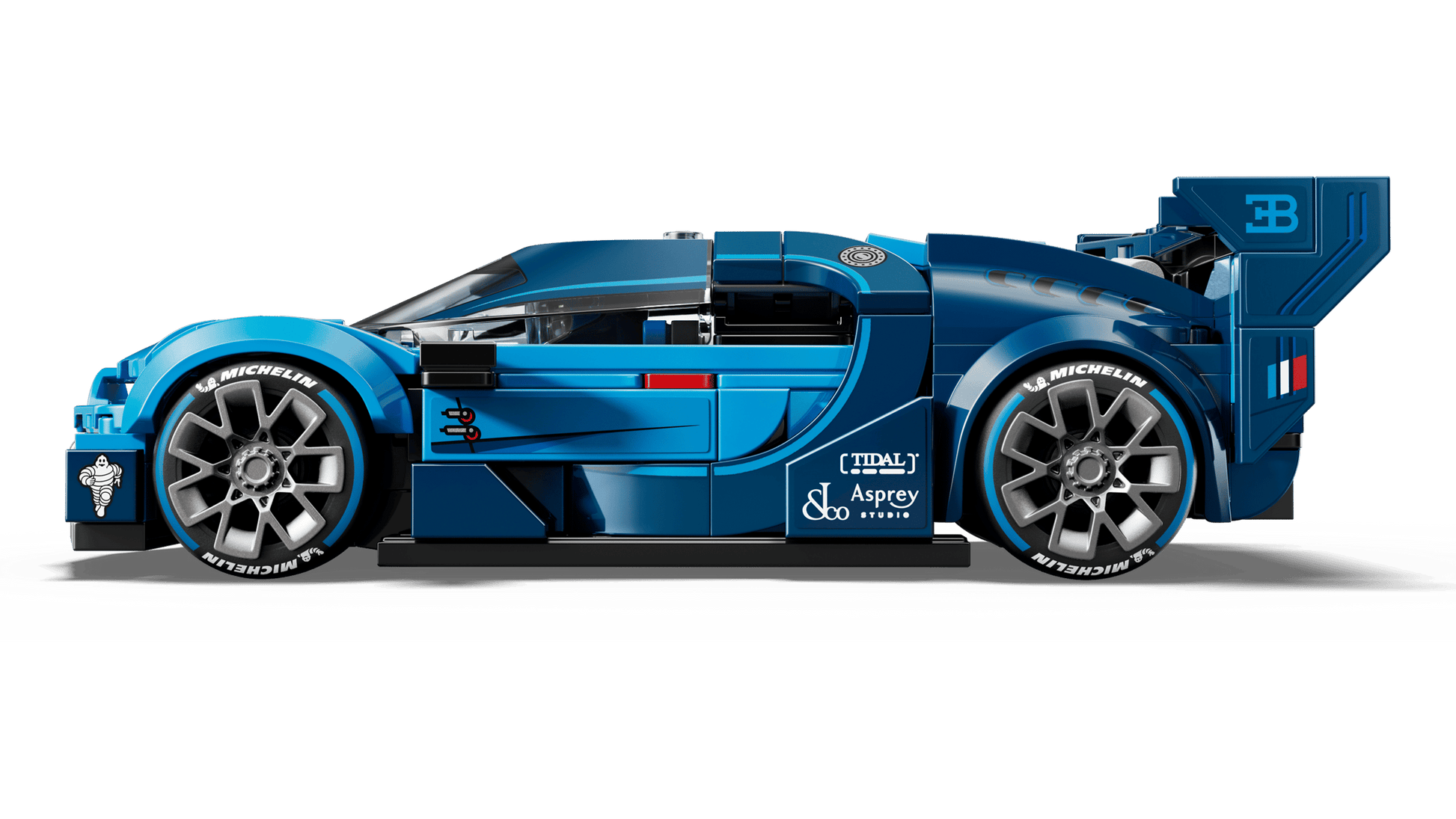 A side view of the LEGO® Speed Champions Bugatti Vision GT Hyper Sports Car by Legos - Toyhouse, featuring blue color, sponsor logos, large wheels, and a rear spoiler inspired by the real Vision Gran Turismo.