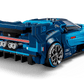 A blue LEGO® Speed Champions Bugatti Vision GT Hyper Sports Car by Legos - Toyhouse, featuring a rear spoiler, detailed exhaust pipes, and branded decals, is shown from the back left angle on a white background.