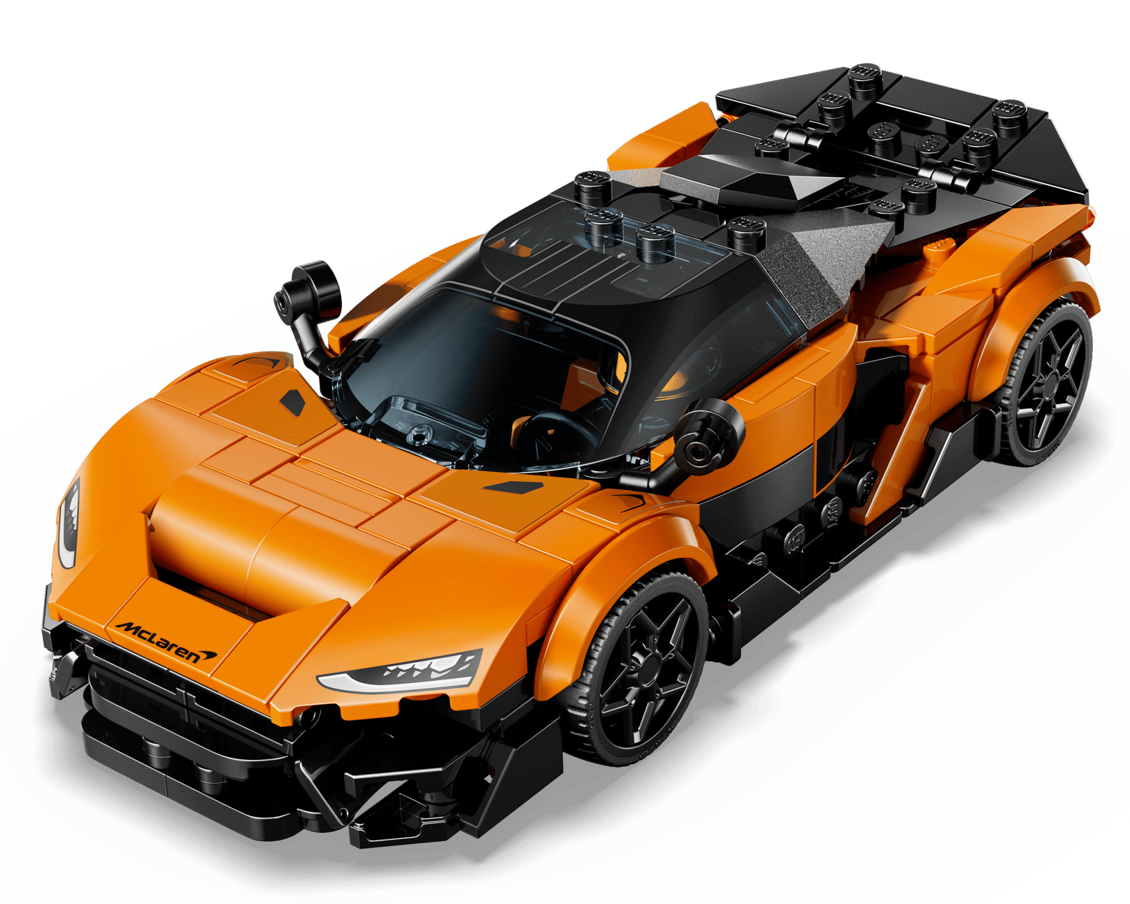 The LEGO® Speed Champions McLaren W1 by Legos - Toyhouse features orange and black styling, detailed headlights, black wheels, and a "McLaren" hood logo, shown from a dynamic front-side angle.