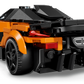 The LEGO® Speed Champions McLaren W1 by Legos - Toyhouse is shown from the rear, displaying black accents, rear lights, and a sporty, aerodynamic design inspired by the original car.