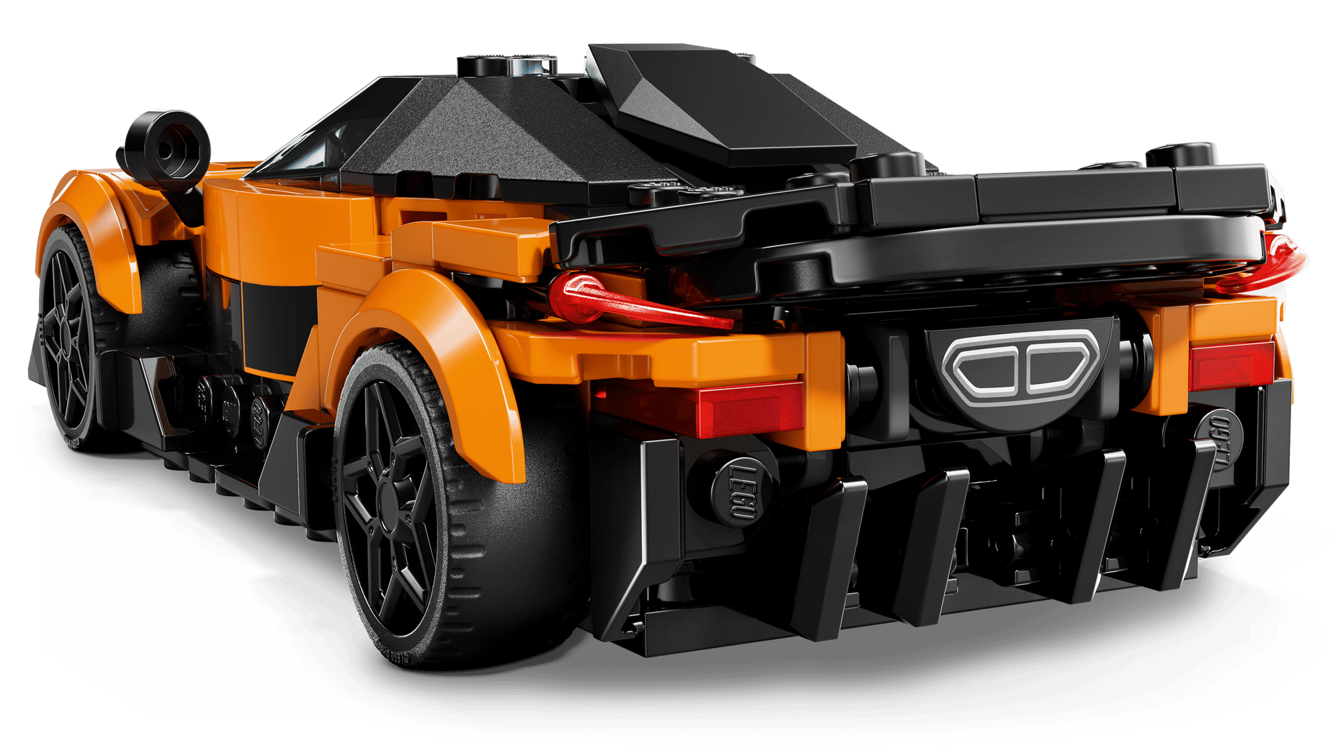 The LEGO® Speed Champions McLaren W1 by Legos - Toyhouse is shown from the rear, displaying black accents, rear lights, and a sporty, aerodynamic design inspired by the original car.
