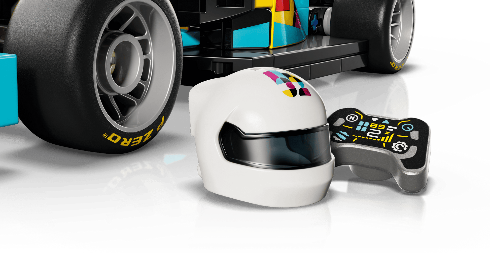 A close-up of a Legos - Toyhouse LEGO® Speed Champions F1 ACADEMY™ LEGO® Race Car toy’s wheel, a white helmet with colorful graphics, and a small remote control on a white surface.