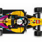 Top-down view of the LEGO® Speed Champions F1 ACADEMY™ LEGO® Race Car by Legos - Toyhouse, featuring a driver in a white helmet and vibrant yellow, pink, black, and blue geometric F1-inspired designs.