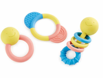 The Hape Rattle & Teether Collection includes a set of three vibrant baby teething rings that also function as rattles. They feature round, textured elements in shades of yellow, pink, and blue against a white background.