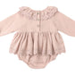 The Baby Girls' Thalia Romper by Quincy Mae features a light pink hue, long sleeves, scalloped collar and hem, coconut back buttons, and delicate eyelet details.