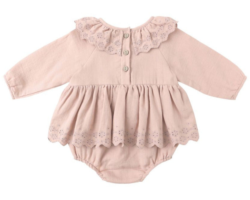 The Baby Girls' Thalia Romper by Quincy Mae features a light pink hue, long sleeves, scalloped collar and hem, coconut back buttons, and delicate eyelet details.