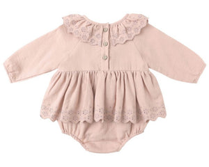 The Baby Girls' Thalia Romper by Quincy Mae features a light pink hue, long sleeves, scalloped collar and hem, coconut back buttons, and delicate eyelet details.