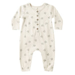 The Quincy Mae Baby Long Sleeve Jumpsuit features a cream color, small bear face prints, and a button-up front with coconut buttons.